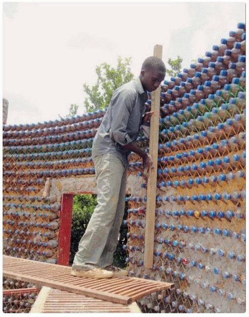 UNUSUAL HOME. THIS GUY BUILT HIS OWN HOUSE OUT OF PLASTIC BOTTLES